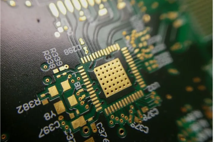 Bare printed circuit board showing copper traces, plated pads and solder mask before component assembly